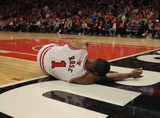 Derrick Rose of the Chicago Bulls lays on the floor after suffering an injury against the Philadelphia 76ers in Game One of the Eastern Conference quarter-finals during the 2012 NBA Playoffs on April 28. The Bulls won 103-91