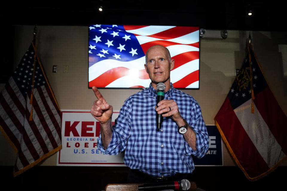 Sen. Rick Scott, R-Fla., speaks during a campaign rally for Republican candidates for U.S. Senate Sen. Kelly Loeffler and Sen. David Perdue on Friday, Nov. 13, 2020, in Cumming, Ga. (AP Photo/Brynn Anderson)