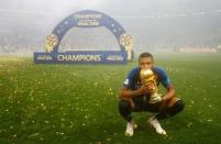 Soccer Football - World Cup - Final - France v Croatia - Luzhniki Stadium, Moscow, Russia - July 15, 2018 France's Kylian Mbappe celebrates with the trophy after winning the World Cup REUTERS/Kai Pfaffenbach