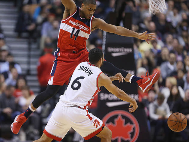 Gary Neal takes a kick at former teammate Cory Joseph. (Getty Images)