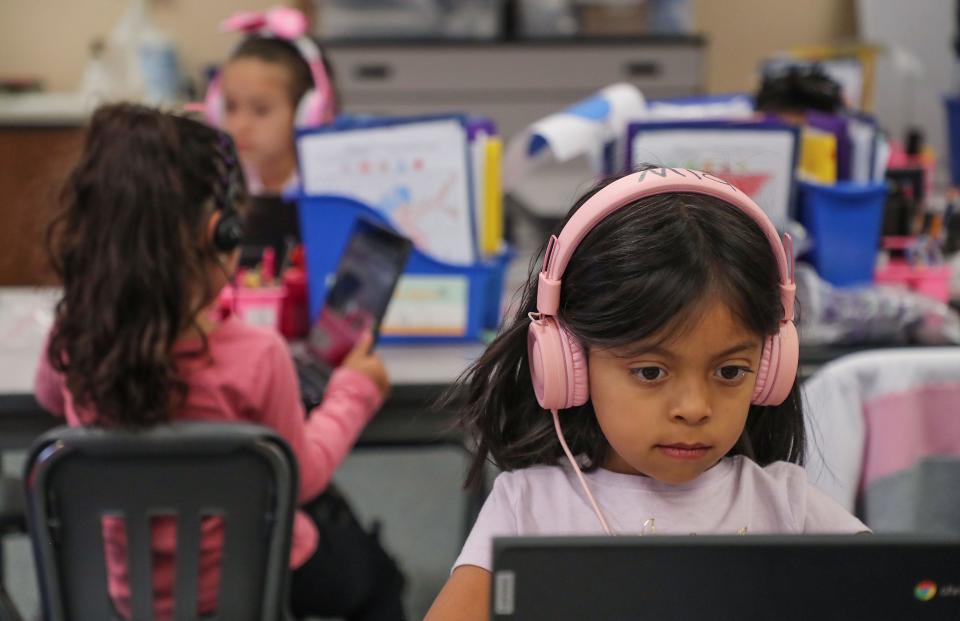 Mia Reyes does her schoolwork on a laptop computer during a dual immersion English and Spanish language in class at Vista Del Monte Elementary School in Palm Springs, Calif., May 3, 2022.