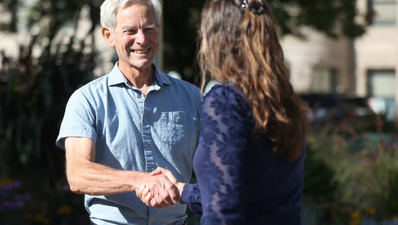 Former Salt Lake City Mayor Ralph Becker, left, shakes hands with Salt Lake City Mayor Erin Mendenhall during a campaign event outside of the Salt Lake City-County Building Wednesday. Becker said he’s voting for Mendenhall in November.