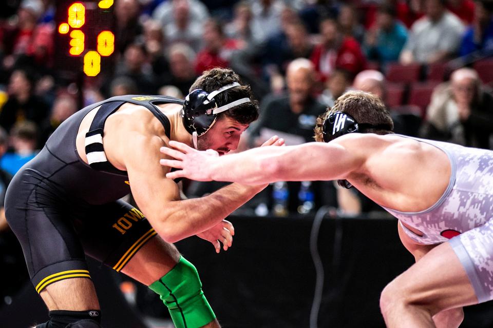 Iowa's Michael Kemerer, left, wrestles Rutgers' Connor O'Neill at 174 pounds during the first session of the Big Ten Wrestling Championships, Saturday, March 5, 2022, at Pinnacle Bank Arena in Lincoln, Nebraska.
