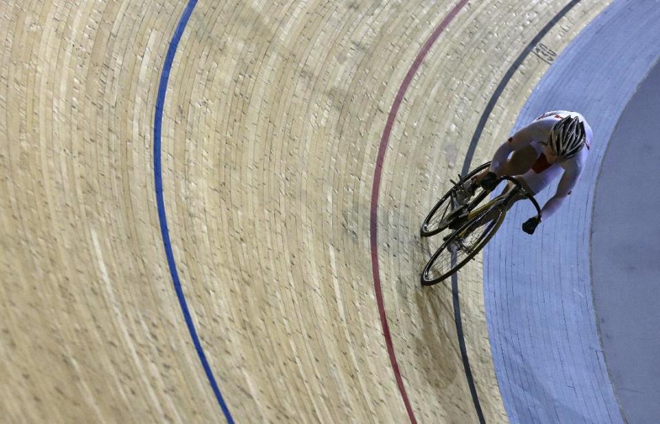 China's Guo Shuang trains for the 2012 Summer Olympics at the Velodrome, Tuesday, July 24, 2012, in London. The opening ceremonies of the Olympic Games are scheduled for Friday, July 27. (AP Photo/Sergey Ponomarev)