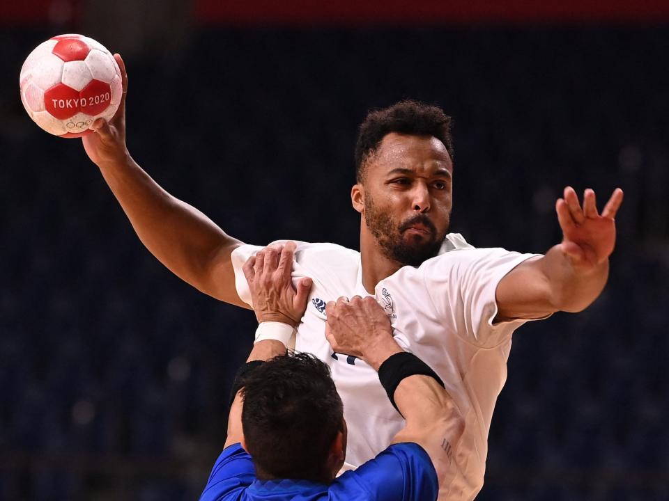 France's Timothey NGuessan competes in handball at the Tokyo Olympics.