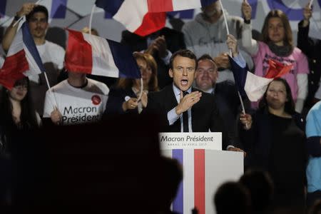 Emmanuel Macron, head of the political movement En Marche !, or Onwards !, and candidate for the 2017 presidential election, attends a campaign rally in Arras, France, April 26, 2017. REUTERS/Benoit Tessier