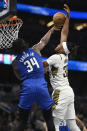 Orlando Magic center Wendell Carter Jr. (34) blocks a shot by Indiana Pacers center Myles Turner, right, during the second half of an NBA basketball game, Sunday, March 10, 2024, in Orlando, Fla. (AP Photo/Phelan M. Ebenhack)