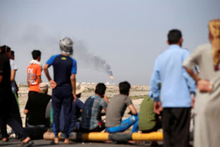 Protesters gather outside the west Qurna 2 oilfield, during a protest in north Basra, Iraq July 14, 2018. Picture taken July 14, 2018. REUTERS/Essam al-Sudani