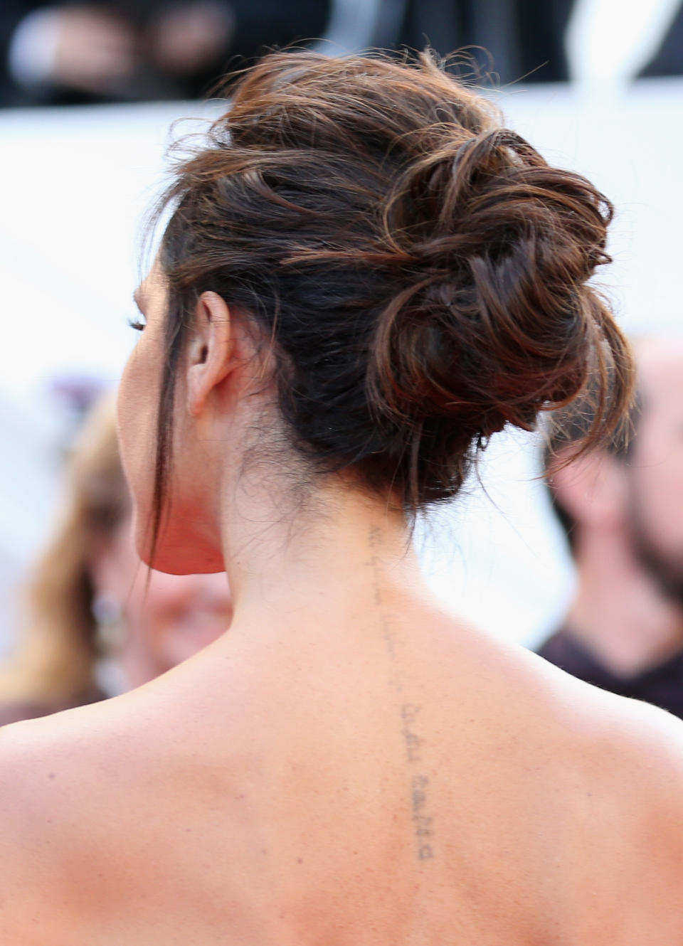 <p>Victoria Beckham has the words ‘I am my beloved’s and my beloved is mine’ in Hebrew down the back of her neck in tribute to her husband, David. But in recent years, the designer has undergone laser removal treatment to remove the ink. <em>[Photo: Getty]</em> </p>