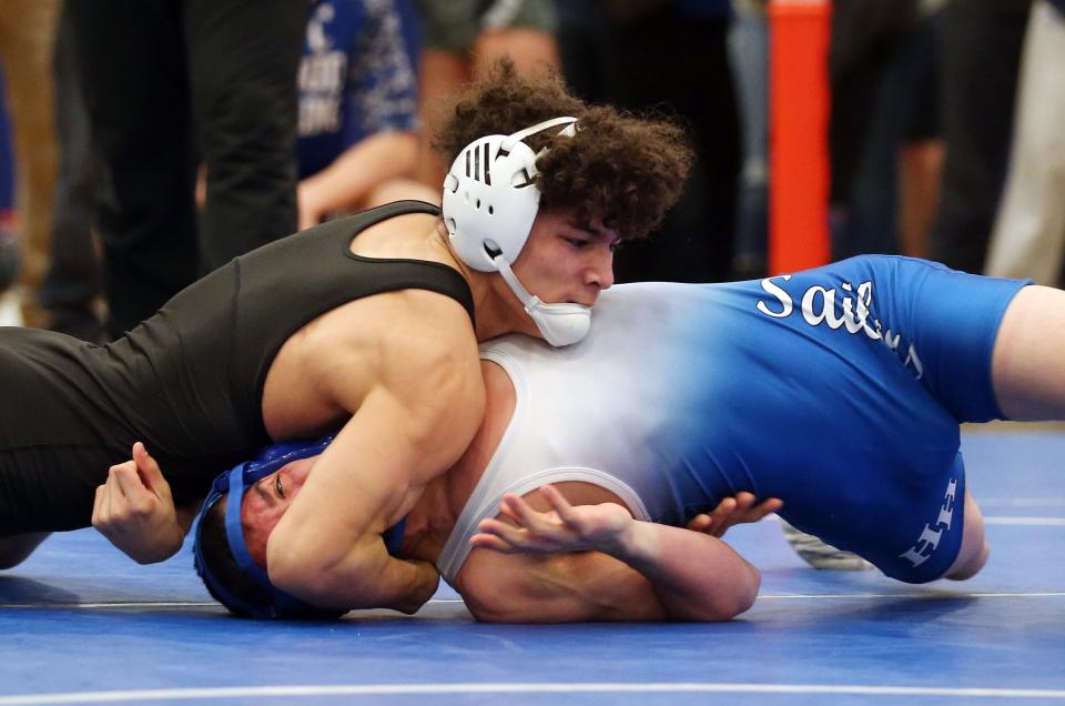 From top, Putnam Valley's Esuar Ordonez on his way to defeating Hendrick Hudson's Shawn O'Mara Jr.  in the 126-pound weight class during the Section 1 Division II wrestling championships at Hendrick Hudson High School in Montrose Feb. 11, 2023. 