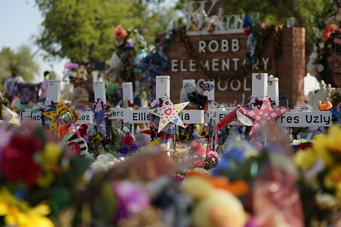 On July 10, 2022, crosses, flowers, and other memorabilia form a makeshift memorial for the victims of the May 24 shooting at Robb Elementary School in Uvalde, Texas.