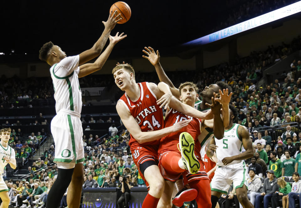 Oregon forward Kwame Evans Jr. (10) grabs rebound against Utah during the second half of an NCAA college basketball game in Eugene, Ore., Saturday, March 9, 2024. Oregon beat Utah 66-65. (AP Photo/Thomas Boyd)