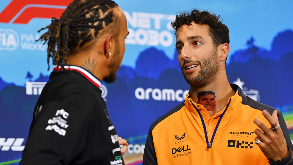 Daniel Ricciardo and Lewis Hamilton have a conversation following a Formula One press conference.