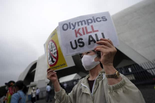 The Tokyo Olympics will get underway in less than two weeks under a state of emergency in Japan's capital and amid opposition from those who fear the potential public health consequences of hosting the international event during a pandemic. (Eugene Hoshiko/The Associated Press - image credit)