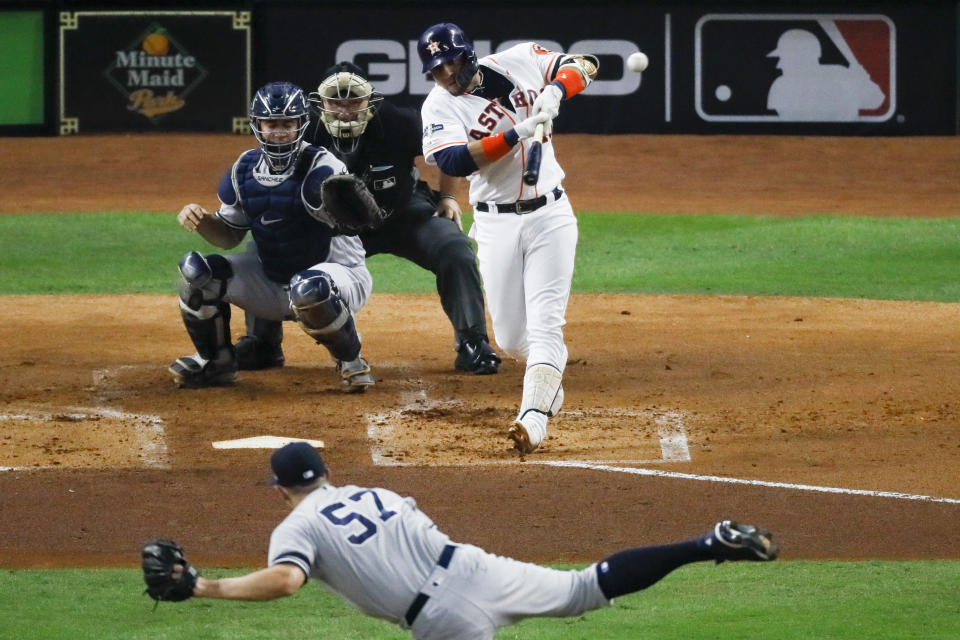 Houston Astros' Yuli Gurriel hits a three-run home run off New York Yankees pitcher Chad Green during the first inning in Game 6 of baseball's American League Championship Series Saturday, Oct. 19, 2019, in Houston. (AP Photo/Sue Ogrocki)