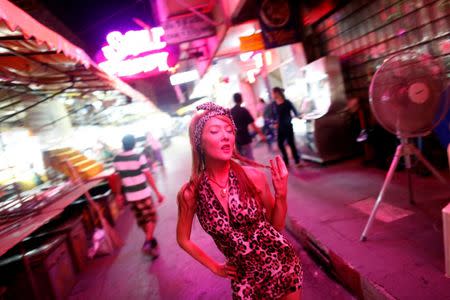 FILE PHOTO: A Thai go-go dancing girl gestures at Bangkok's Patpong red-light area late May 29, 2010. REUTERS/Damir Sagolj/File Photo