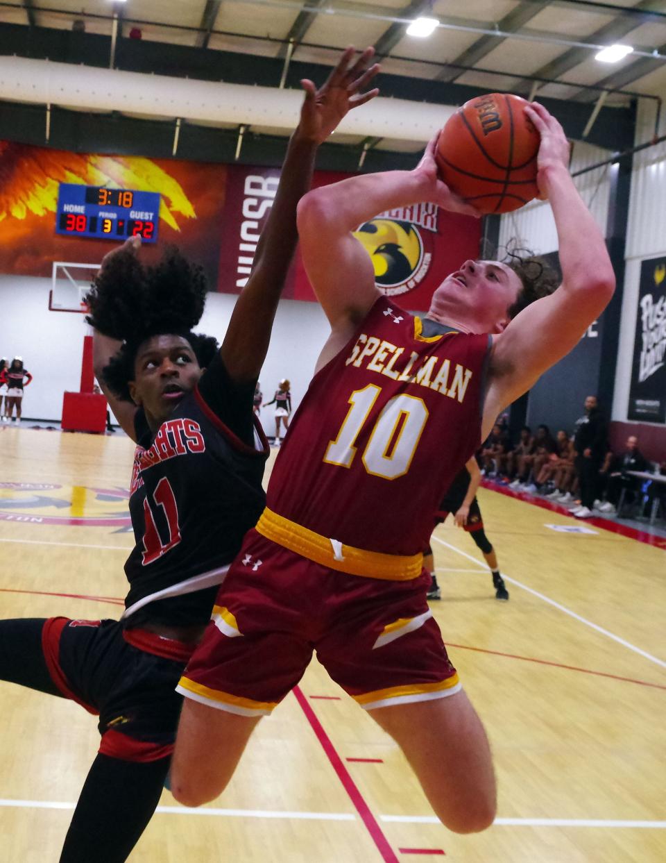 Jaylen Thomas (L) tries to swat away a shot by a determined Matt O'Donnell of Cardinal Spellman in the 2nd half of the game on Wednesday, Jan. 3, 2024.