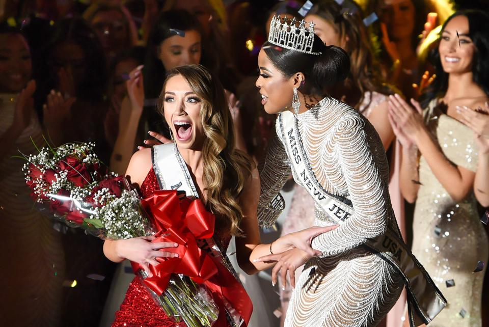 Celinda Ortega, Miss New Jersey USA 2021, celebrates with Alexandra Lakhman, the newly crowned Miss New Jersey USA, during the final competition at the Hilton Parsippany on April 2, 2022.