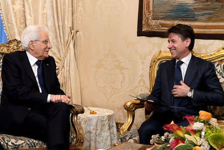 Italy's Prime Minister-designate Giuseppe Conte talks with the Italian President Sergio Mattarella at the Quirinal Palace in Rome, Italy, May 31, 2018. Italian Presidential Press Office/Handout via REUTERS ATTENTION EDITORS - THIS IMAGE HAS BEEN SUPPLIED BY A THIRD PARTY.