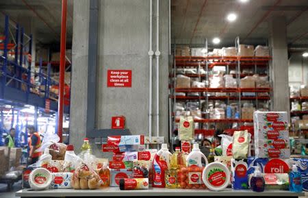 RedMart's in-house label products are displayed at RedMart's fulfillment centre in Singapore September 22, 2017. Picture taken September 22, 2017. REUTERS/Edgar Su