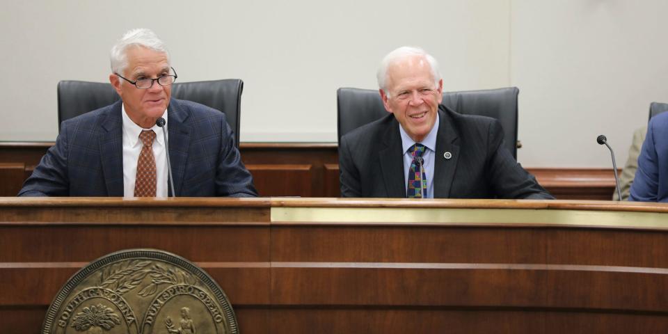 South Carolina Sen. Chip Campsen, R-Isle of Palms, left, and Rep. Bill Taylor, R-Aiken, right, listen to a senator speaking online during a conference committee hearing on Wednesday, June 15, 2022, in Columbia, S.C.