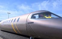 Bruce Best cleans the cockpit inside the mockup of Bombardier’s Learjet Liberty 75 at the National Business Aviation Association (NBAA) exhibition in Las Vegas