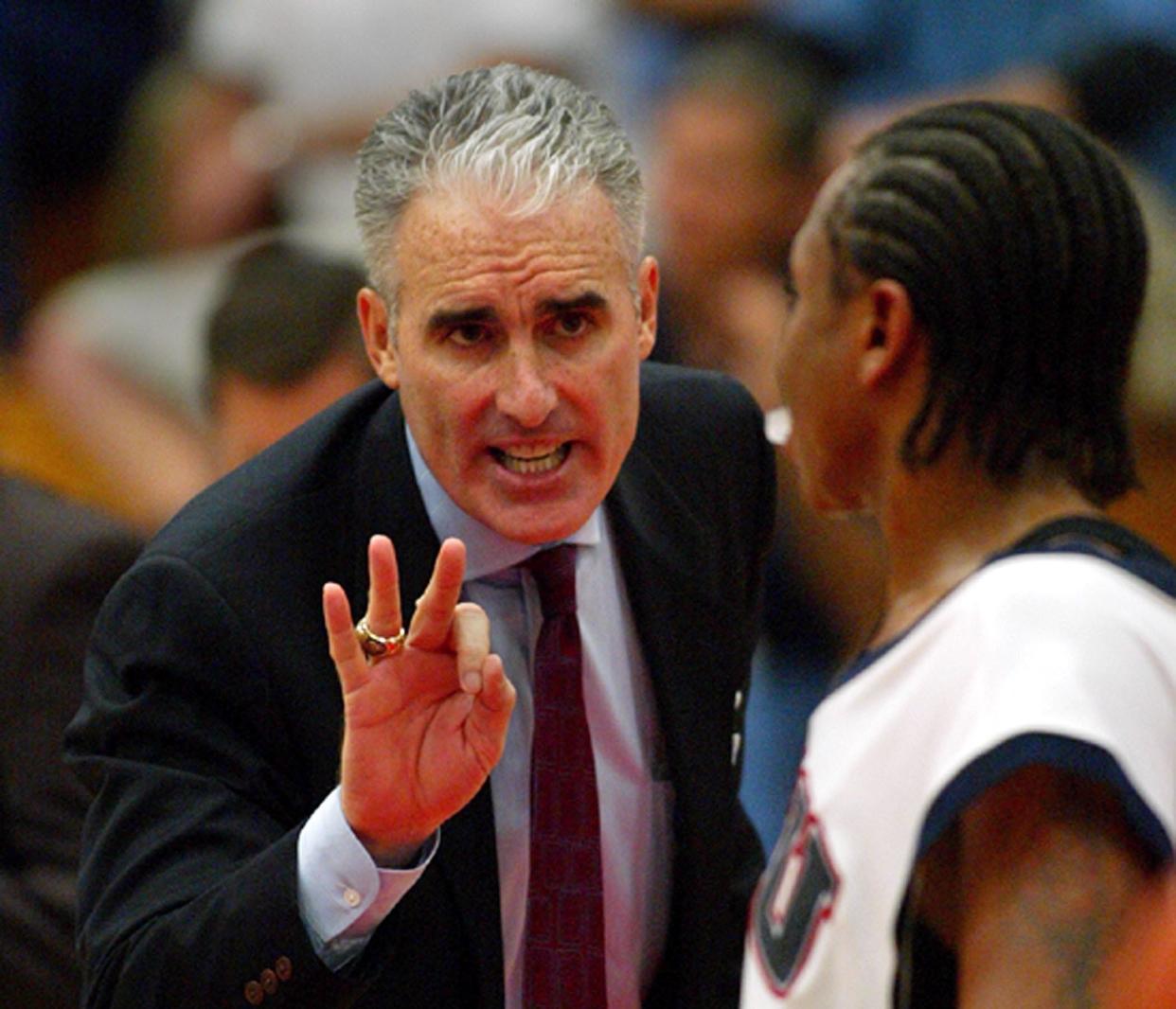 Owls coach Matt Doherty (cq) gives Brent Crews direction during the game during their win over the Ospreys 77-75 on Nov. 30, 2005.