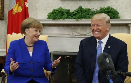 U.S. President Donald Trump meets with German Chancellor Angela Merkel in the White House Oval Office in Washington, U.S., April 27, 2018. REUTERS/Kevin Lamarque