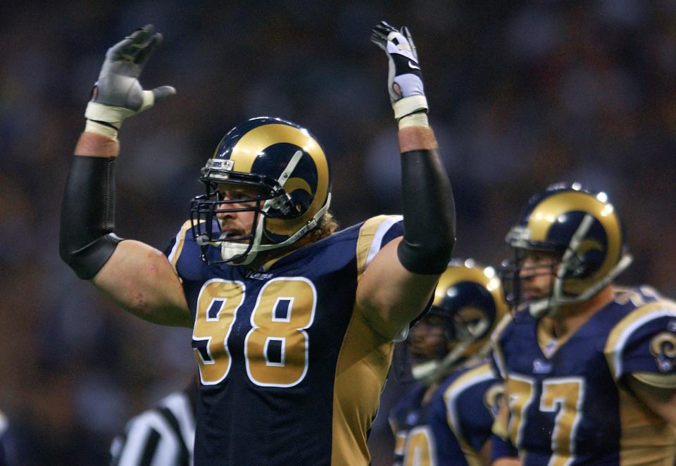 27 Jan 2002:  Grant Wistrom #98 of the St. Louis Rams celebrates after he sacked Donovan McNabb of the Philadelphia Eagles during the second half of the NFC Championship Game at the Dome at America's Center in St. Louis, Missouri. The St. Louis Rams beat the Philadelphia Eagles 29-24 to advance to the Super Bowl.  DIGITAL IMAGE. Mandatory Credit: Elsa /Getty Images
