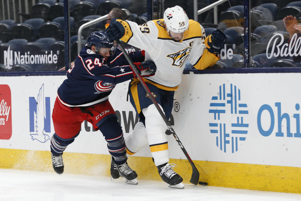 olumbus Blue Jackets' Nathan Gerbe, left, checks Nashville Predators' Roman Josi during the second period of an NHL hockey game Monday, May 3, 2021, in Columbus, Ohio. (AP Photo/Jay LaPrete)