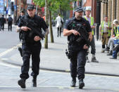 <p>Armed police patrol the streets near to Manchester Arena in central Manchester, England, Tuesday May 23, 2017. (AP Photo/Rui Vieira) </p>