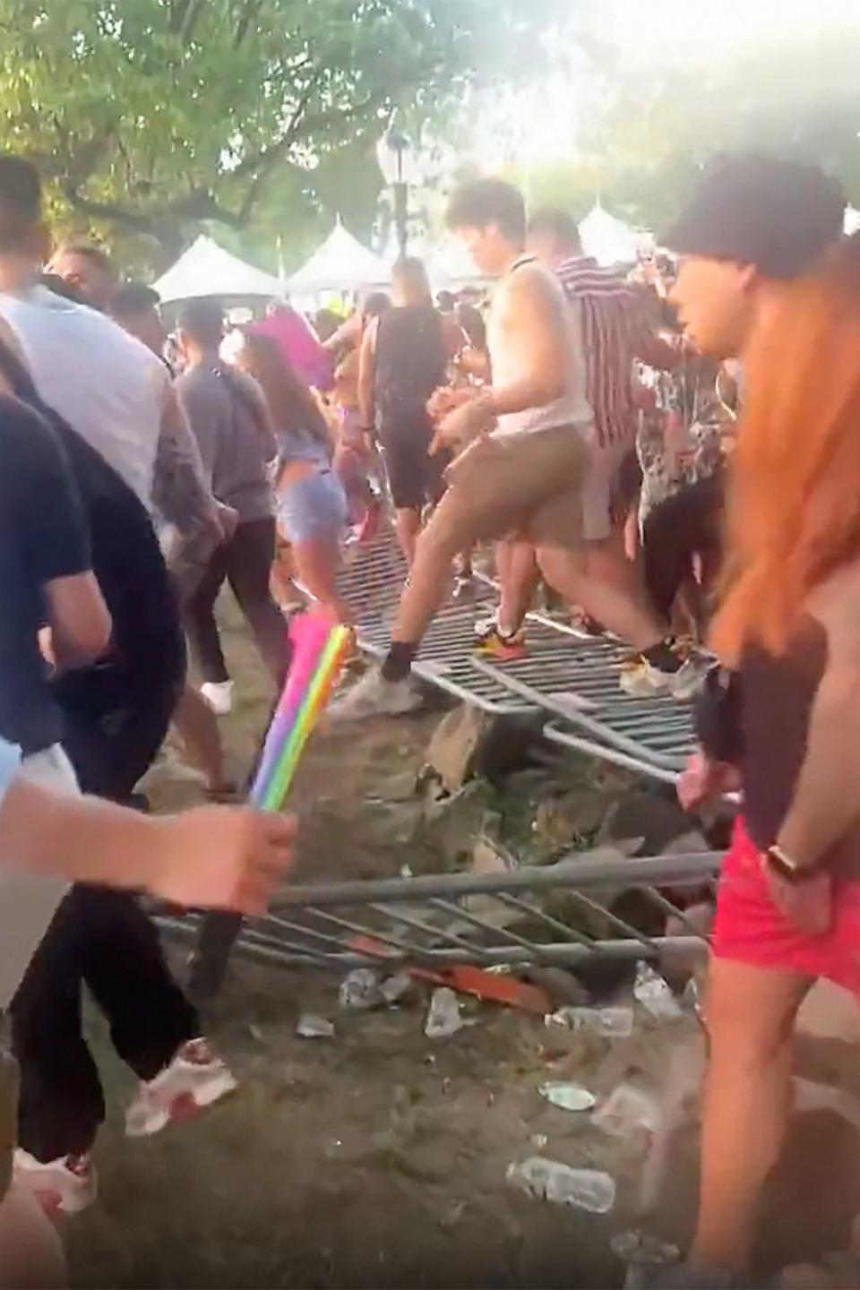 PHOTO: People rush the gates on the second day of the Electric Zoo Festival at Randall's Island in New York City, Sept. 3, 2023. (@julianstweet)