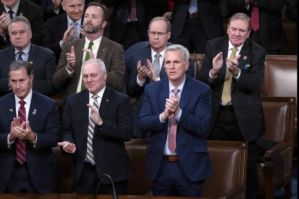 FILE - House Republican Leader Kevin McCarthy, R-Calif., stands with Minority Whip Steve Scalise, R-La., left, and other Republicans before an address by Ukrainian President Volodymyr Zelenskyy in the House chamber, at the Capitol in Washington, Wednesday, Dec. 21, 2022. The new 118th Congress, with Republicans in control of the House, begins Jan. 3, 2023, but the first task for the GOP is electing a new speaker and whether House Republican Leader Kevin McCarthy, R-Calif., can overcome opposition from conservatives in his own ranks to get the job. (AP Photo/J. Scott Applewhite, File)