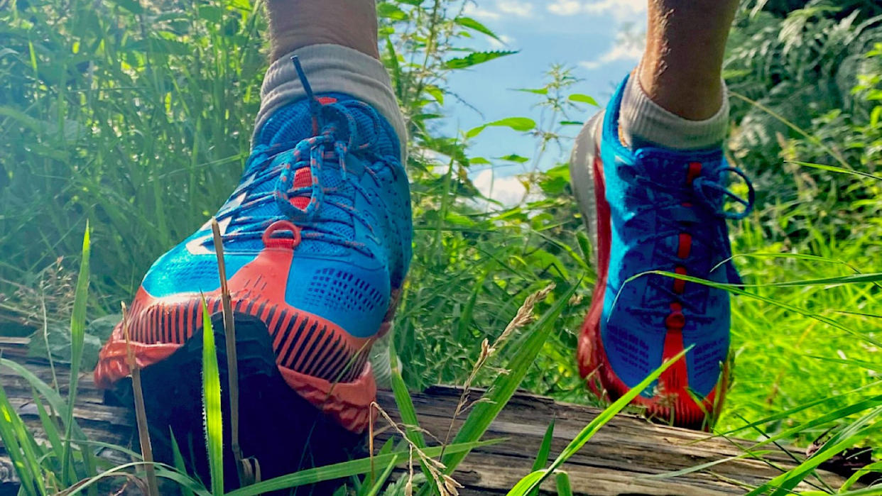  Man wearing Merrell Agility Peak 5 trail running shoes 