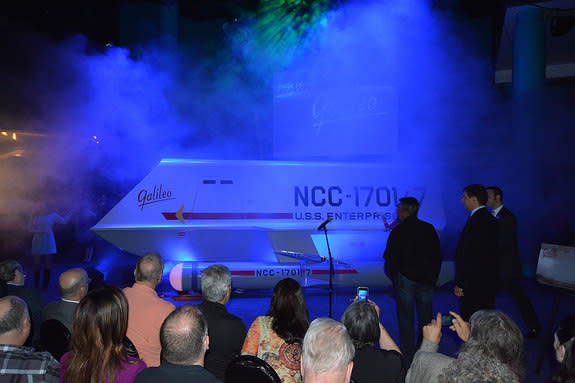 “Star Trek” superfan Adam Schneider and actor Don Marshall watch as the “Galileo” shuttlecraft is revealed at Space Center Houston in Texas, July 31, 2013.