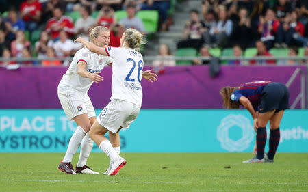 Soccer Football - Women's Champions League Final - Ferencvaros Stadium, Budapest, Hungary - May 18, 2019 Olympique Lyonnais' Amandine Henry and Carolin Simon celebrate winning the Women's Champions League REUTERS/Lisi Niesner