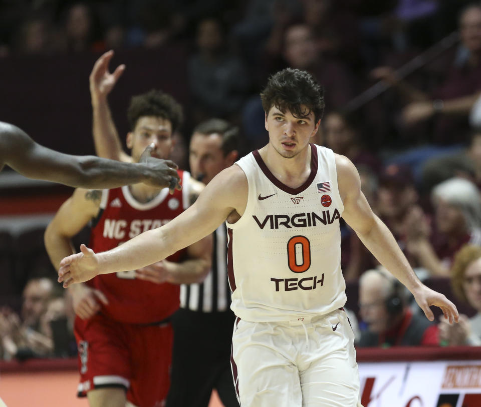 Virginia Tech's Hunter Cattoor (0) celebrates a 3-point basket in the first half of an NCAA college basketball game against North Carolina State Saturday, Jan. 11, 2020, in Blacksburg, Va. (Matt Gentry/The Roanoke Times via AP)