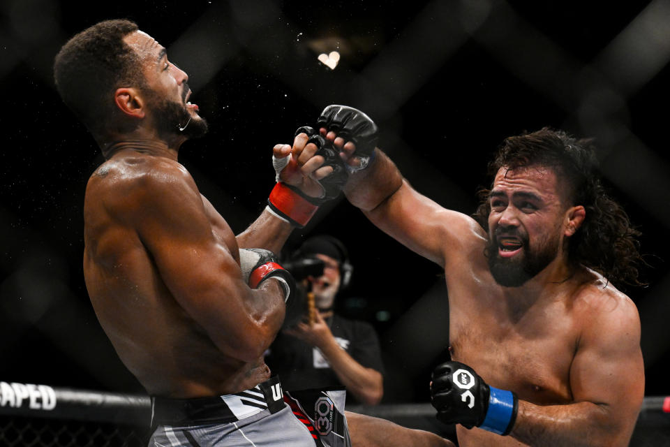 Jul 22, 2023; London, UNITED KINGDOM; Danny Roberts (red gloves) fights Jonny Parsons (blue gloves) during UFC Fight Night at O2 Arena. Mandatory Credit: Per Haljestam-USA TODAY Sports