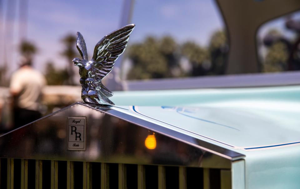 The hood ornament of a Rolls Royce-style golf cart is seen parked near the driving range during the 16th annual Nation Desert Classic at Indian Wells Country Club in Indian Wells, Calif., Saturday, May 4, 2024.