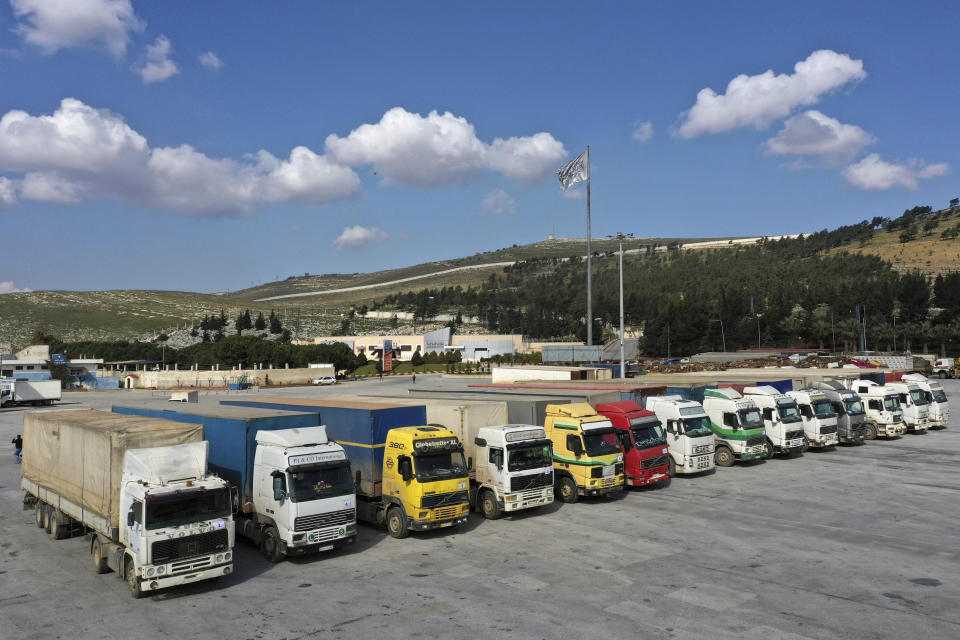 FILE - Trucks loaded with UN humanitarian aid for Syria following a devastating earthquake reach the Bab al-Hawa border crossing with Turkey, Idlib province, Syria, Friday, Feb. 10, 2023. After years of war, residents of areas in northwest Syria struck by a massive earthquake are grappling with their new and worsening reality. (AP Photo/Ghaith Alsayed, File)