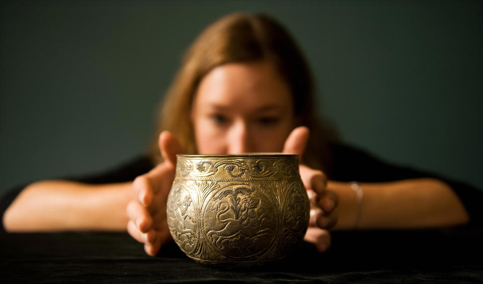 A gilt silver vessel from the Vale of York viking hoard is displayed at a press conference to unveil the newly conserved hoard at the British Museum in central London, on August 27, 2009. Worth GBP 1.1m (dollars 1.8m or euro 1.3m) the items will be displayed equally between joint-owners York Museums Trust (York) and the British Museum. AFP PHOTO/Leon Neal (Photo credit should read Leon Neal/AFP via Getty Images)