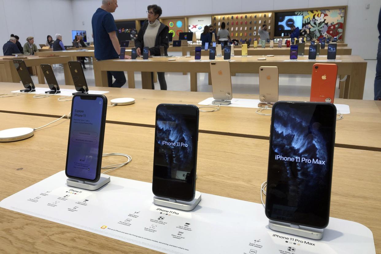 A selection of iPhones are displayed an Apple store Tuesday, Jan. 28, 2020, in suburban Boston. Apple reports financial earns on Tuesday. (AP Photo/Steven Senne)