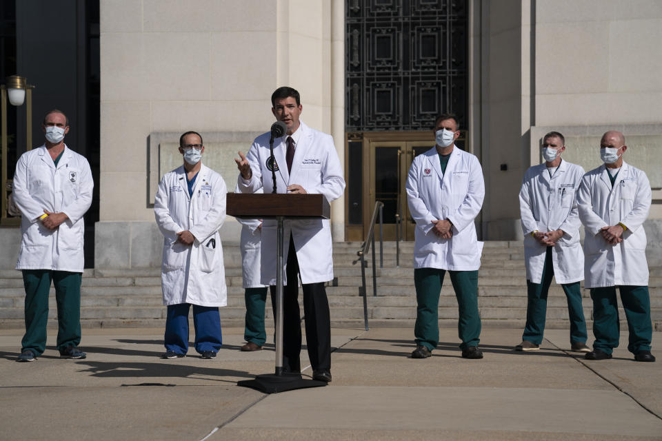 FILE - In this Oct. 5, 2020, file photo, Dr. Sean Conley, physician to President Donald Trump, talks with reporters at Walter Reed National Military Medical Center in Bethesda, Md. The U.S. death toll from the coronavirus has eclipsed 400,000 in the waning hours in office for Trump. (AP Photo/Evan Vucci, File)