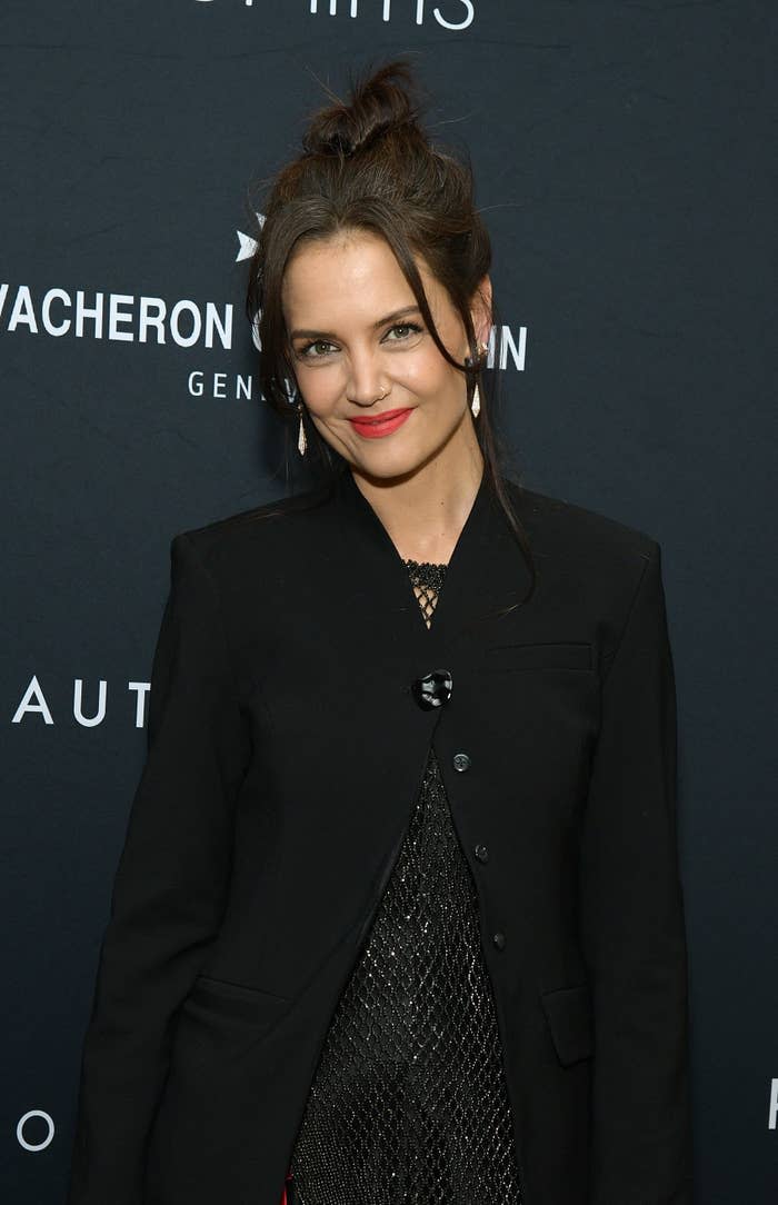 A close-up of Katie smiling slightly at a red carpet event