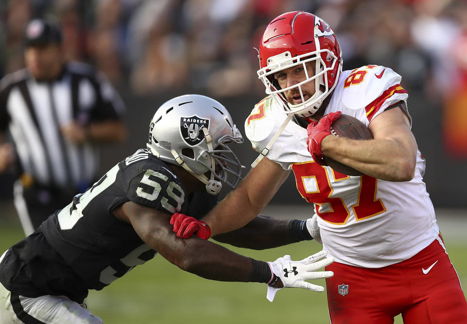 Kansas City Chiefs tight end Travis Kelce (87) runs against Oakland Raiders linebacker Tahir Whitehead (59) during the second half of an NFL football game in Oakland, Calif., Sunday, Dec. 2, 2018. (AP Photo/Ben Margot)