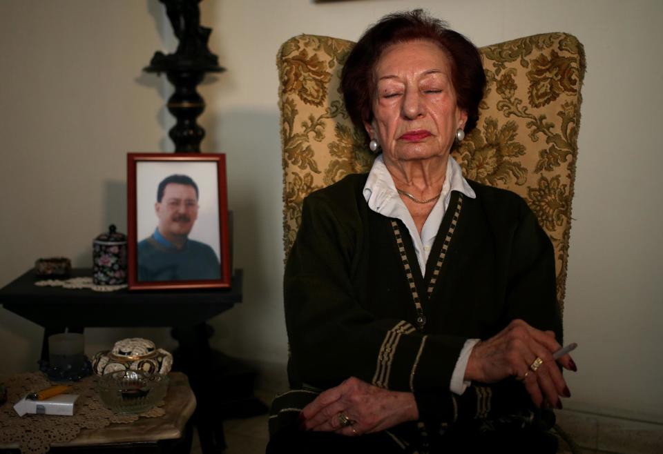 In this Thursday April 10, 2014 photo, Lebanese Mary Mansourati, 82, reflects on her son Dani who went missing in Syria in 1992 at the age of 30, his portrait seen at left, as she speaks during an interview with the Associated Press at her house, in Beirut, Lebanon. Dani is among an estimated 17,000 Lebanese still missing from the time of Lebanon’s civil war or the years of Syrian domination that followed. Syria’s civil war has added new urgency to the plight of their families, many of whom are convinced their loved ones are still alive and held in Syrian prisons, at risk of being lost or killed in the country’s mayhem. (AP Photo/Hussein Malla) (AP Photo/Hussein Malla)