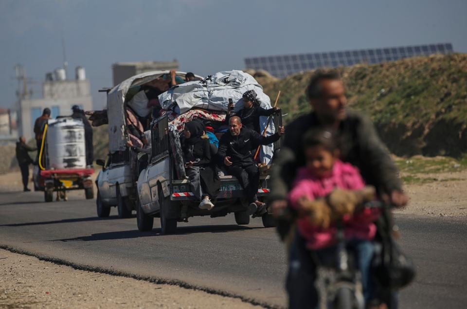 Residents evacuate from Rafah in the southern Gaza Strip, 14 February 2024 (EPA)