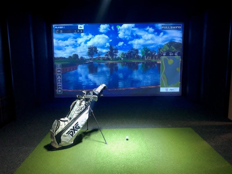 Milwaukee Third Ward's new sports bar District Fore has two golf simulator bays.