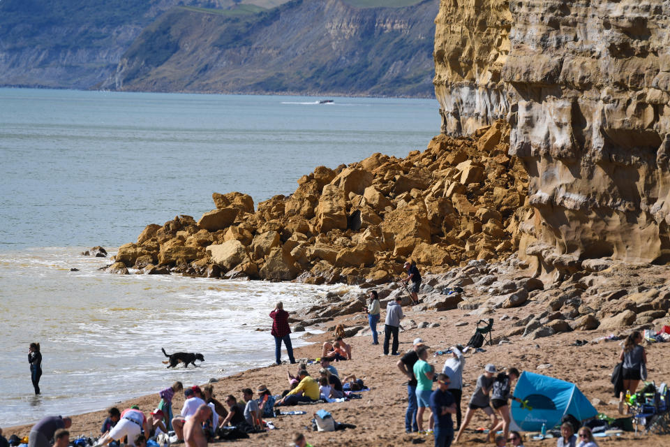 BURTON BRADSTOCK, UNITED KINGDOM - AUGUST 29: General view of the 9,000 ton cliff fall on August 29, 2020 in Burton Bradstock, Dorset, England. The fall happened at Hive Beach near the village of Burton Bradstock shortly before 06:30 BST, Dorset Council said. Fire crews using thermal imaging equipment were called in to check for any trapped casualties but nothing was found. The council described it as a "huge" rock fall and said recent heavy rain had made cliffs unstable. (Photo by Finnbarr Webster/Getty Images)