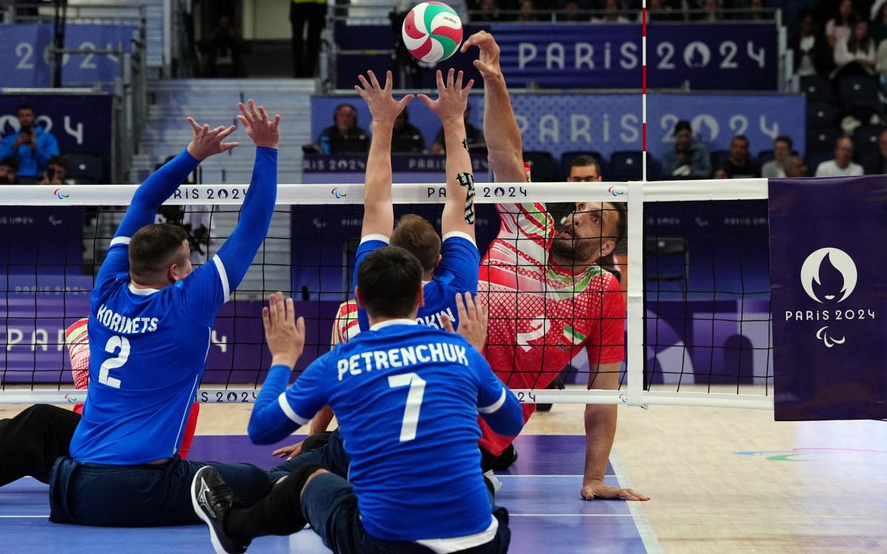 Morteza Mehrzadselakjani in action for the Iranian sitting volleyball team against Ukraine at the Paris Paralympics